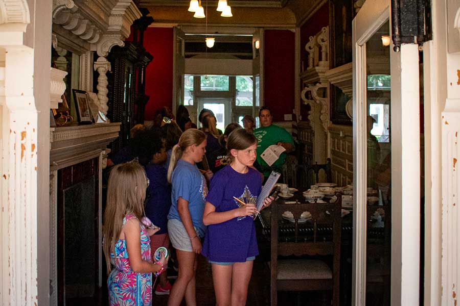 Young visitors enjoying an interactive scavenger hunt while on tour